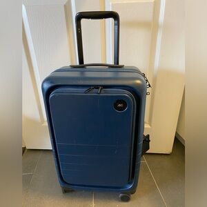 Monos Carryon Pro blue spinner wheel suitcase